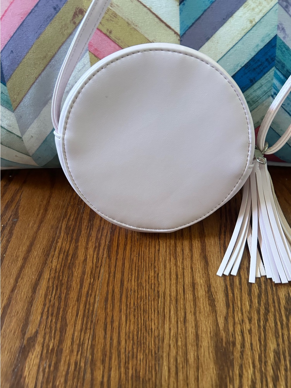 Round White Laser-Cut Crossbody Bag with Tassel - Picture 2 of 3